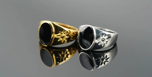 Detailed view of vintage steel signet rings with black stones and star carvings