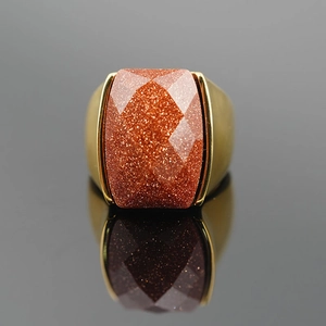 Classic vintage gold steel ring featuring a large rectangular faceted red goldstone gem
