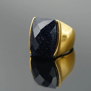 Classic vintage gold titanium steel ring featuring a faceted blue sandstone gemstone