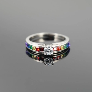 Titanium steel ring with round center stone and rainbow channel-set square stones