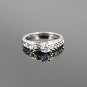 Elegant titanium steel wedding ring featuring a central round diamond and side square stones