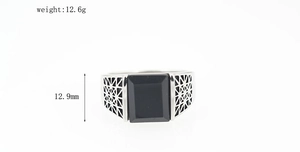 Detail shot of vintage men's stainless steel ring with black gemstone and 12.9mm width