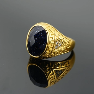 Vintage gold-plated men's signet ring with blue sandstone gem and intricate carvings