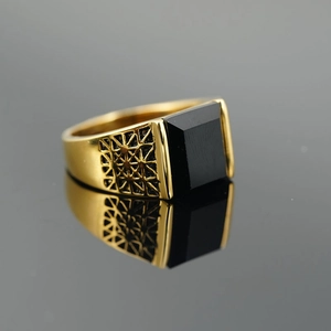 Vintage golden steel men's ring with square black stone and geometric镂空 details