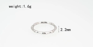 Detail of silver bamboo-style titanium steel ring showing 2.2mm width and 1.6g weight