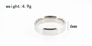 Close-up of a 6mm silver stainless steel band ring weighing 4.9g with a polished finish