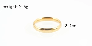 Polished gold stainless steel ring detail with dimensions 3.9mm width and 2.6g weight