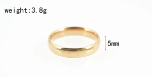 Close-up of 5mm wide polished gold stainless steel ring weighing 3.8g with dimensions
