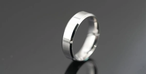 Detail of minimalist silver steel ring featuring brushed center and polished edges
