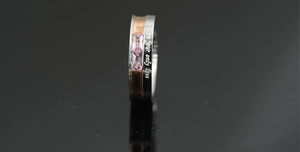 Detail of two-tone ring with pink zircons and I am your only love engraving