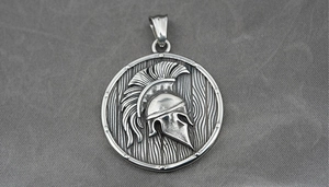 Close-up of vintage Spartan helmet pendant on stainless steel Viking necklace shield