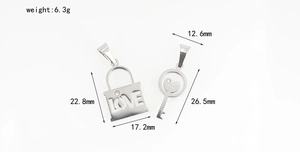 Polished stainless steel couple's lock and heart key pendants with LOVE engraving and diamond