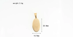 Detailed view of oval gold stainless steel pendant with religious scripture engraving