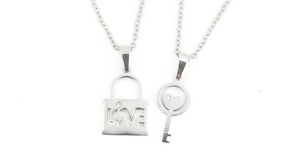 Detailed view of silver stainless steel love lock and heart key pendant necklaces