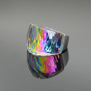 Exaggerated silver ring with rainbow faceted gemstone and shiny vertical reflection