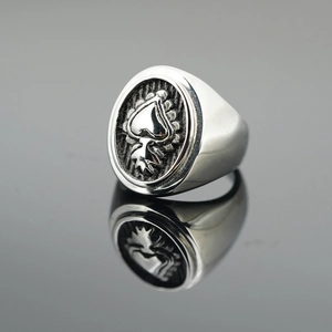Vintage steel signet ring for men with embossed sacred heart on dark oval face