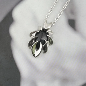 Gothic obsidian teardrop pendant necklace with silver eagle claw design on O-chain