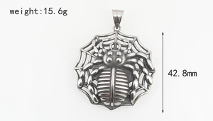 Detailed view of hip-hop spider web pendant with 15.6g weight and 42.8mm size specs