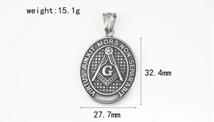 Macro view of vintage Freemason pendant with G compass and Latin inscription
