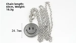 Detailed view of silver titanium steel necklace with 24.7mm rotating smiley face pendant