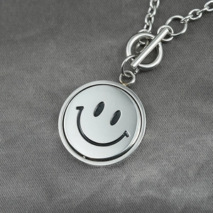 Titanium steel necklace with rotating smiley face pendant and OT buckle closure