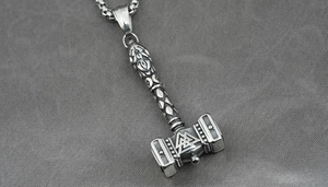 Detailed view of Viking Mjolnir pendant with Valknut symbol on stainless steel chain