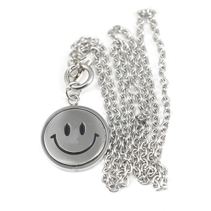 Hip hop titanium steel necklace featuring a rotating double-sided smiley face and OT clasp