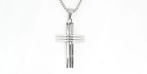 Detailed view of silver cross pendant with triple stacked metal bars on a box chain