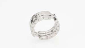 Detail of silver titanium steel ring with FOREVER engraving and triple-layer design