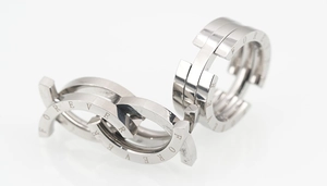 Macro shot of interlocking polished steel rings featuring the Forever engraving detail