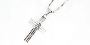 Close-up of triple-layered silver steel cross pendant with a detailed box chain necklace
