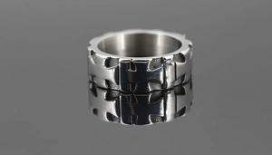 Macro view of vintage titanium steel ring with embossed cross pattern carvings