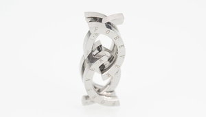 Macro shot of interlocking silver steel rings with decorative Forever engraving details