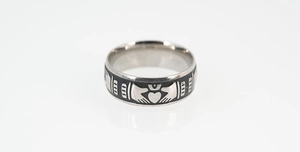 Detail of vintage Claddagh ring featuring hands holding heart with crown in silver and black