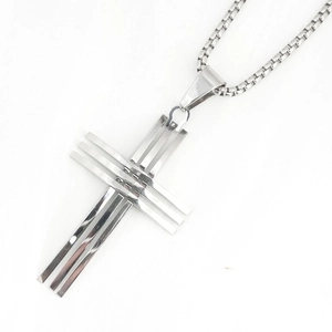 Silver stainless steel cross necklace with a layered geometric pendant and box chain
