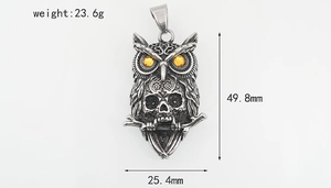 Detailed measurements of vintage owl and skull pendant with amber gemstone eyes