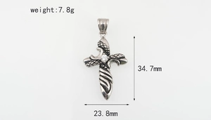 Macro detail of diamond-set steel cross pendant showing precise 34.7mm by 23.8mm dimensions