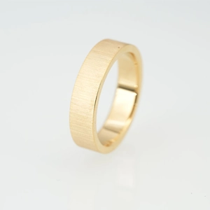 Golden titanium steel ring with a matte brushed finish and polished inner surface