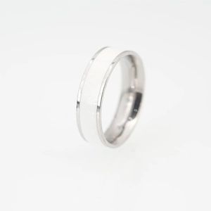 Polished titanium steel ring with central white ceramic inlay in a modern unisex style