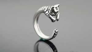 Macro detail of vintage tiger ring showing the engraved King character on forehead