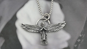 Detailed close-up of retro silver angel prayer pendant and square box chain necklace