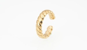 Detail of a golden twisted rope pattern ring with a polished finish and open C-shape design