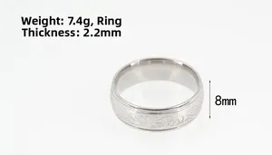 Close-up of engraved vine patterns on 8mm wide stainless steel band ring, 2.2mm thickness