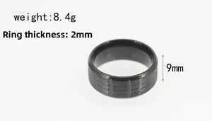 Detailed view of a 9mm wide black titanium steel ring with textured vertical grooves