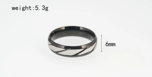 Macro detail of 6mm black titanium steel ring showing weight of 5.3g and textured silver slits