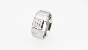 Close-up of men's titanium steel ring with geometric grid engraved texture