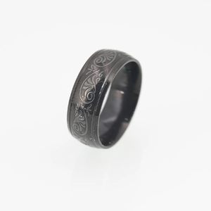 Men's vintage black titanium steel ring with intricate vine pattern engraving
