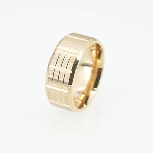 Men's wide gold titanium steel ring with textured brushed finish and vertical grooves
