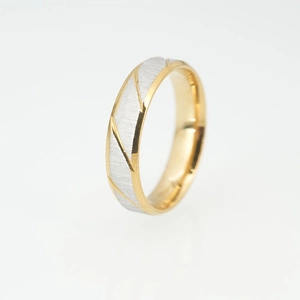 Minimalist brushed titanium steel ring featuring gold trim and diagonal groove textures