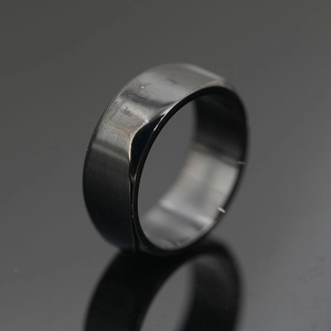 Minimalist dark grey titanium steel ring with smooth polished finish for men and women